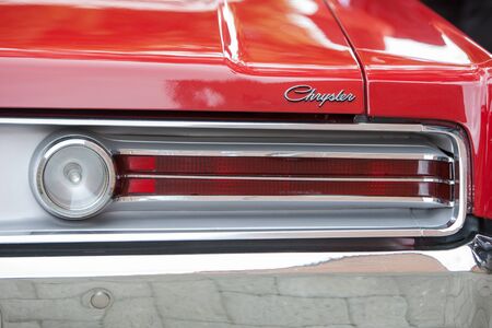 Close up detail of the rear of a 60s vintage red Chrysler 300 showing the taillightsのeditorial素材