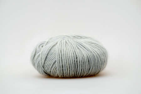 Grey blue colored ball of threads wool yarn on white background. High quality photo