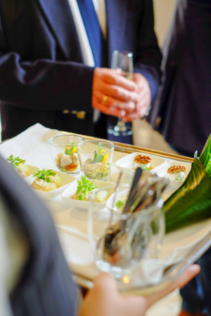The waiter is holding snacks catering. High quality photoの写真素材