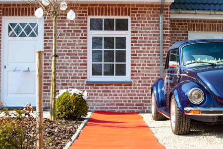 Antwerp, Belgium, March 2009: Two blue German classic cars. Volkswagen Beetle in front of a house on a wedding day. High quality photoのeditorial素材