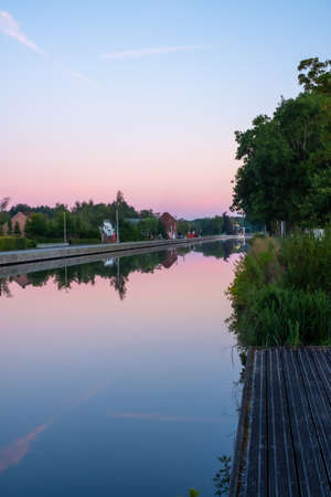 Colourful Sunsets Over a canal or river. High quality photoの写真素材