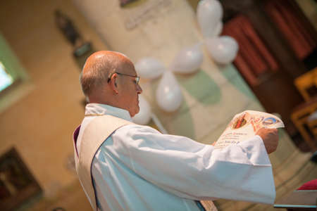 20-06-2009, Antwerp, Priest during a wedding ceremony or nuptial mass. High quality photoのeditorial素材
