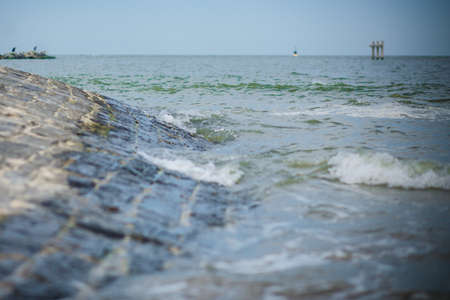 waves in the sea that hit the rocks on the beach. High quality photoの写真素材