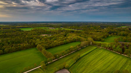 Aerial landscape of countryside with colorful storm clouds. Extreme thunderstorm over a farm and...