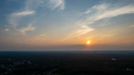 Colorful sky background sunset, illuminated pink-orange dramatic clouds, aerial photography, far...