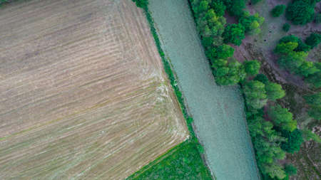 Beautiful natural Patterns of Farmfields in Countryside at Summer. Drone Aerial View, birds eye...