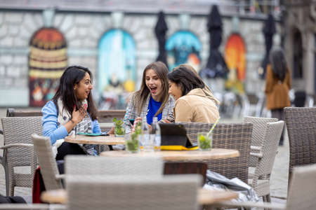 Diverse group of young business woman drinking cocktails in an European city . High quality photoの写真素材