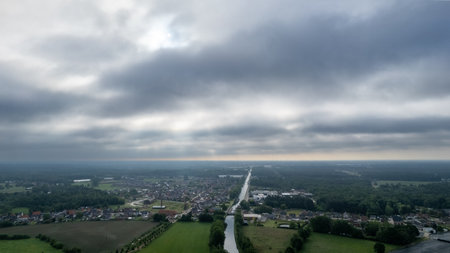 Rijkevorsel, Belgium, 14th of april, 2022, Little village of Sint Jozef, on the canal Dessel Schoten aerial photo in Rijkevorsel, kempen, Belgium, showing the waterway in the natural green agricultural landscape. High quality photo. High quality photoの写真素材
