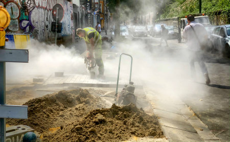 Brussels, Belgium, 08 July 2022, Working People, construction workers, doing Road Work on Laying Asphalt on the City Street . High quality photoのeditorial素材