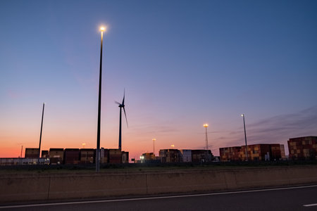 Antwerp, Belgium, Europe, 20th of april, 2022, A row of container cranes jut out into Antwerp Harbor on a foggy evening. High quality photoのeditorial素材