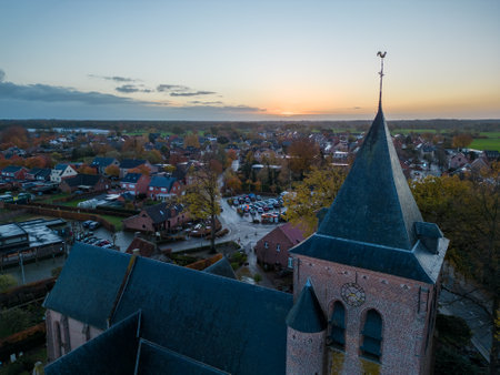 Belgium, Wortel, Hoogstraten, 24 november 2022, Aerial drone photo of the early Gothic Saint John Baptist Church, Sint-Jan Baptist kerk in the Klinketstraat, Wortel, Hoogstraten. High quality photoのeditorial素材