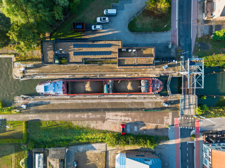 Rijkevorsel, Belgium, 9th of June, 2022, Little village of Sint Jozef, on the canal Dessel Schoten aerial photo during morning sunrise in Rijkevorsel, kempen, Belgium, showing the waterway in the natural green agricultural landscape. High quality photo. High quality photoの写真素材