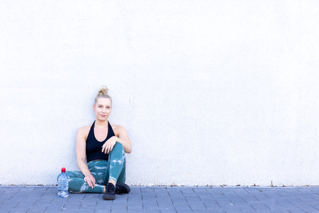 A vibrant representation of the sport and lifestyle concept, featuring a sporty blonde woman taking...