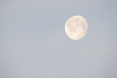 On a clear evening, the full moon illuminated the sky, creating an atmosphere for tranquil imagery and peaceの写真素材