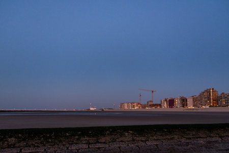 Nieuwpoort, Belgium, October 5th, 2024, This image captures a mesmerizing coastal landscape at dusk, showcasing its stunning beauty and soft lightの写真素材
