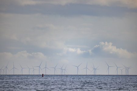 Eierland, De Cocksdorp, Texel, The Netherlands, Oktober 28th, 2024, A picturesque view of wind turbines on the horizon, symbolizing renewable energy and sustainability.の写真素材