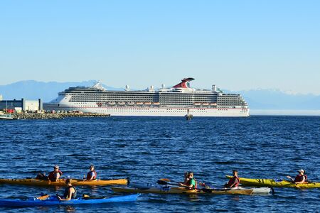 Victorias busy harbor with kayakers cruise ships and a beautiful summer day of 2014.のeditorial素材