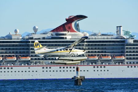 Victorias busy inner harbor,sea planes taking off and cruise ships docked,come to Victoria and enjoy west coast life.のeditorial素材