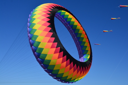 Kites flying in the wing at the kite festival.のeditorial素材