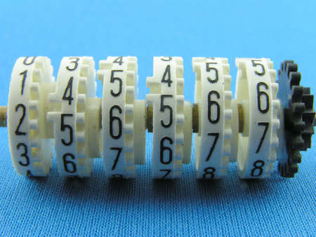 The mechanical counter. A close up on a blue background.