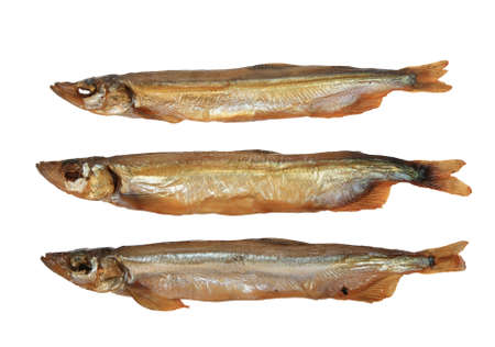 Group of three a smoked golden fishs. Close-up. Isolated on white background.の写真素材