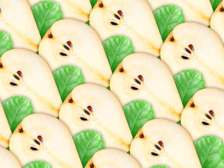 Abstract background of fresh pear slices and green leaf for your design. Close-up. Studio photography. Attention - it is not a seamless pattern.の写真素材