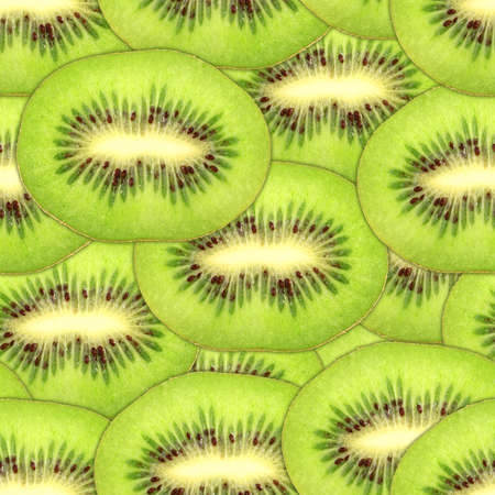 Abstract background with slices of fresh ripe green kiwi. Seamless pattern for your design. Close-up. の写真素材