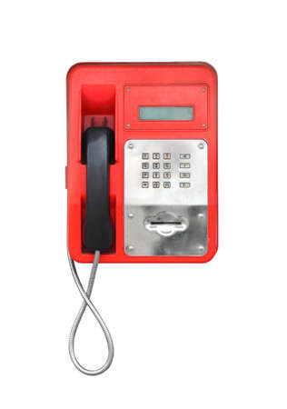 Red urban dirty payphone. Isolated on white background. Close-up.