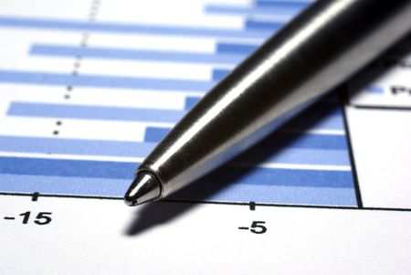 Steel pen macro on printed report with diagramm. Financial concept.の写真素材