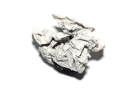 Creased newspaper. Isolated on white with shadow.の写真素材