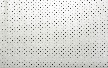 High quality perforated beige leather. Interior of modern japanese car. Background or backdrop.の写真素材