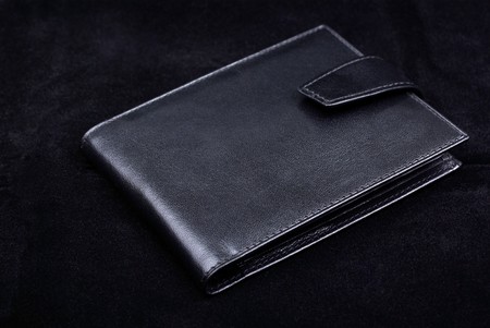 New wallet made of high quality leather isolated on black velvet background. Studio shot.の写真素材