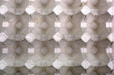 Empty cardboard package for eggs as background or backdrop.