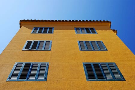 Yellow architecture of small Lloret de Mar city. Costa Brava, Spain.の写真素材