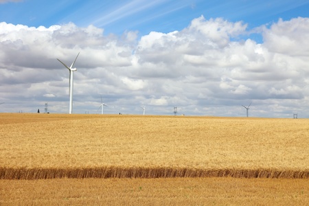 French field with wind power generators, Europe.の写真素材