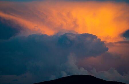 Stormy sunset sky clouds backgroundの写真素材