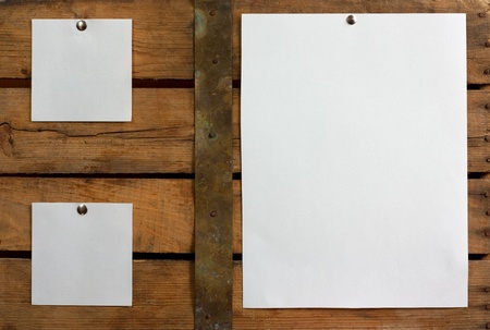 Three pieces of blank paper tacked to wooden background.Ready for your text の写真素材