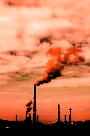 Global warming concept.Smoke rising from factoryの写真素材
