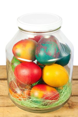 Easter concept.Colorful easter eggs in a jarの写真素材
