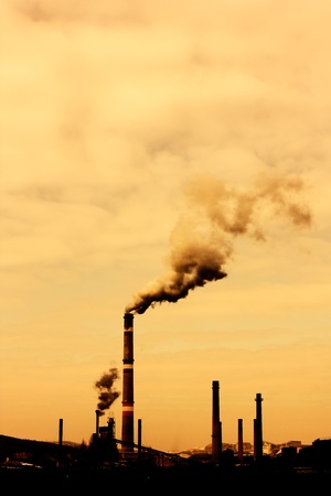Global warming concept in sepia.Pollution smoke from factoryの写真素材