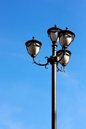 Street lamp on a sunny day with a blue sky backgroundの写真素材