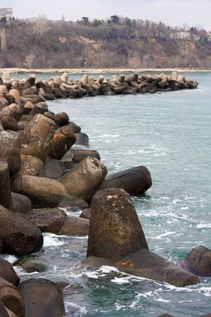 Breakwater concrete stones on a cloudy day  in the city of Varna,Bulgariaの写真素材