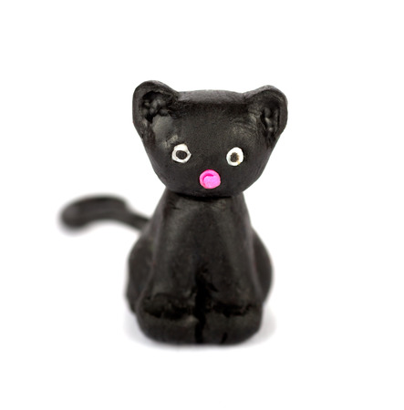 Hand made plasticine or modeling clay figure of a cat on white background.Shallow DOFの写真素材