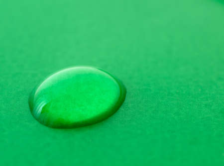 Water drop on green background.Macro, shallow DOFの写真素材