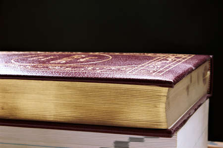 Stack of books on dark backgroundのeditorial素材