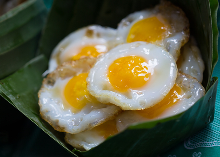 Fresh Fried Quail Eggs in banana leaves bowlの写真素材