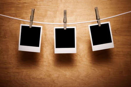Polaroids on a wooden backgroundの写真素材