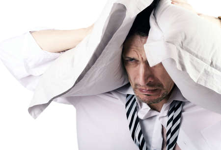 The businessman was closed from problems by pillowsの写真素材