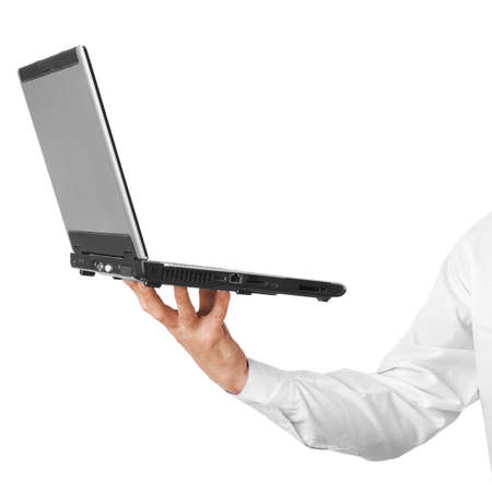 The laptop on a hand of the businessman. The isolated white backgroundの写真素材