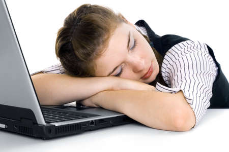 The girl and the laptop. The girl was prepared for examinations and has fallen asleepの写真素材
